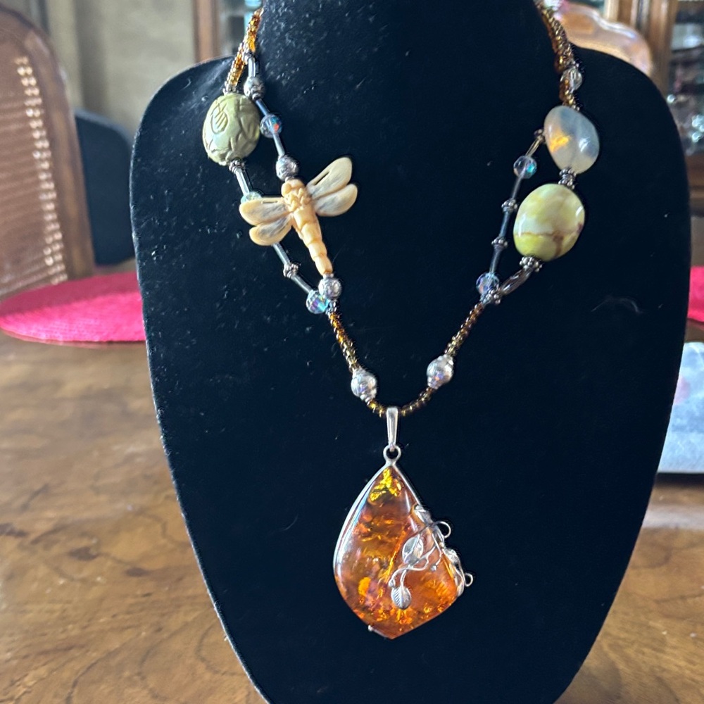 Baltic Amber set in silver with carved bone dragonfly and jade necklace
